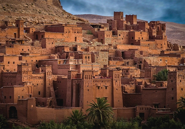 Ait-Benhaddou Kasbah in cloudy day during discovering Ouarzazate destination