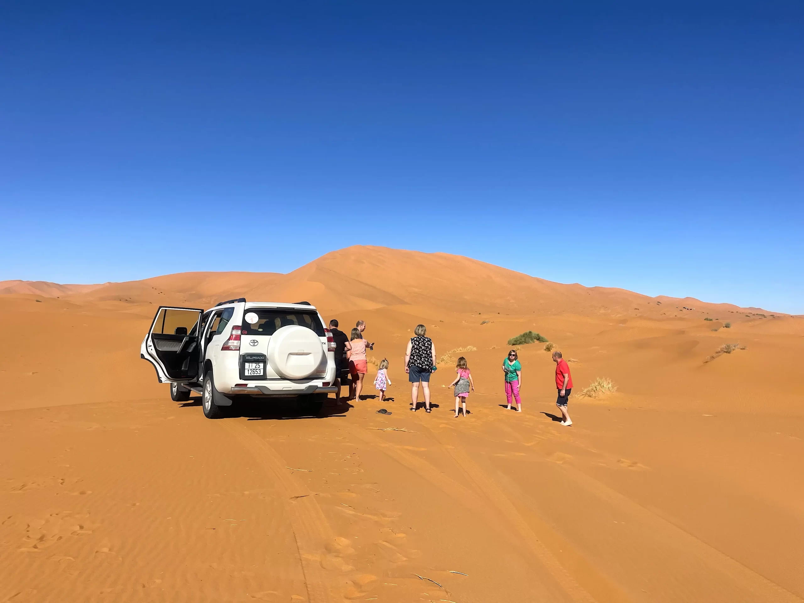 Tourist-family A family with kids visit Sahara desert in Morocco