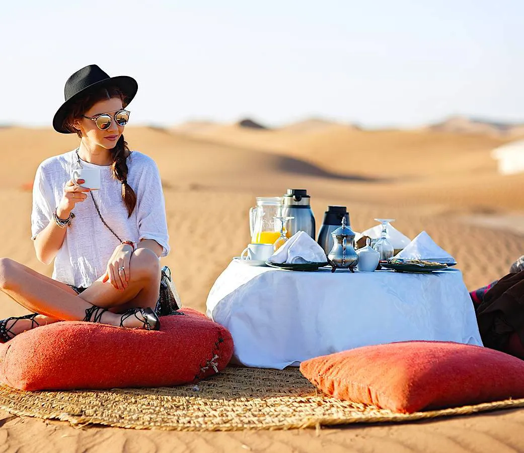 Luxury-tour-Morocco setting and having breakfast in the desert during luxury tour