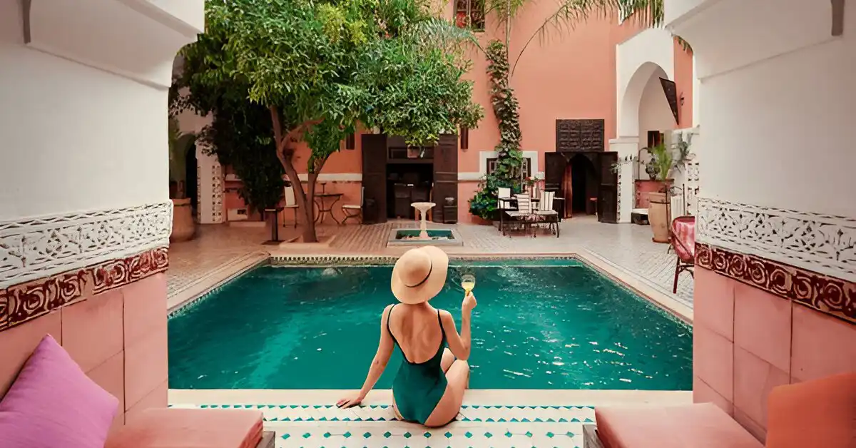 having a drink in Riad in from of the pool during the luxury tour