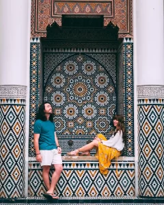 Couple exploring a traditional riad as part of their private honeymoon in Morocco.