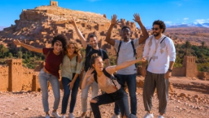 Group of friends exploring Aït Ben Haddou during a bachelor trip in Morocco.