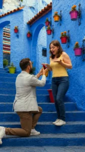 Man proposing to his partner in Chefchaouen, Morocco, during a private marriage proposal.